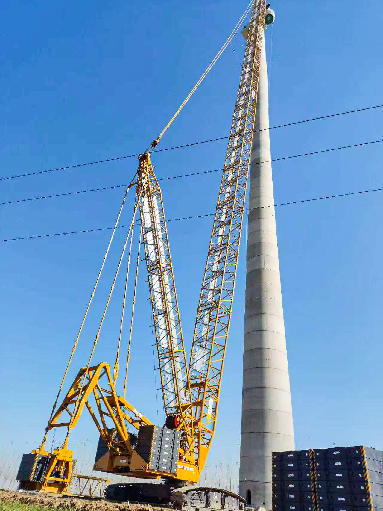 160米高空精准“搭积木”：k豆钱包XLC15000M分体吊装6.25兆瓦风机全纪录